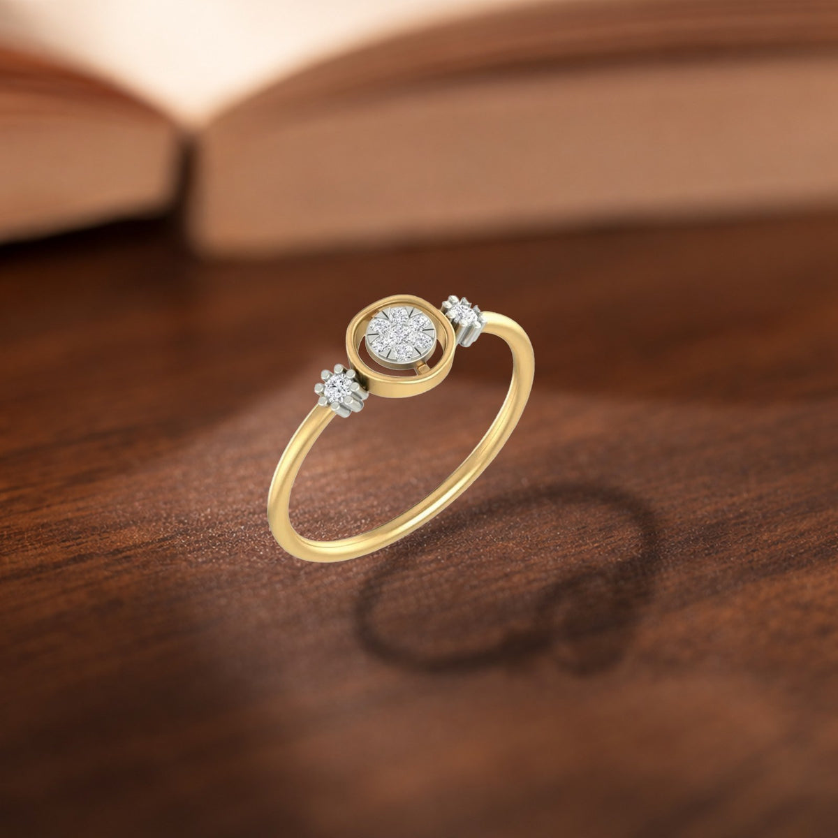 Gold ring with a diamond on a wooden surface.