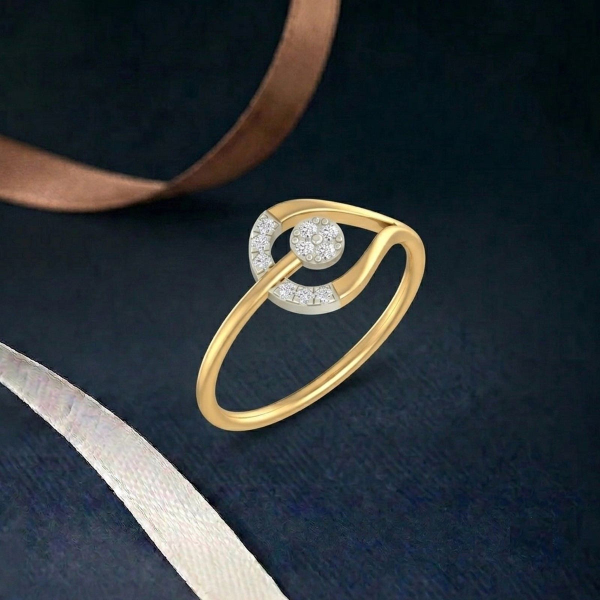 Gold ring with diamonds on a teal  background