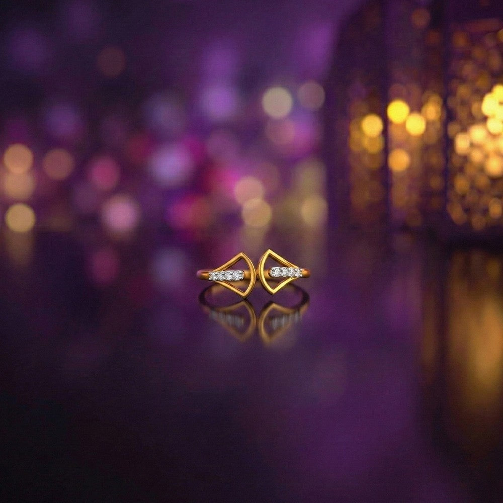 Gold and diamond with cuff on a refective surface.