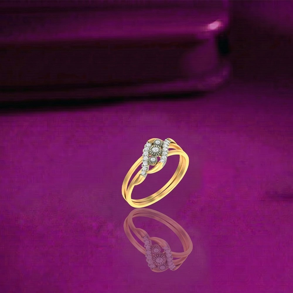 Gold and diamond women's ring on a magenta surface.