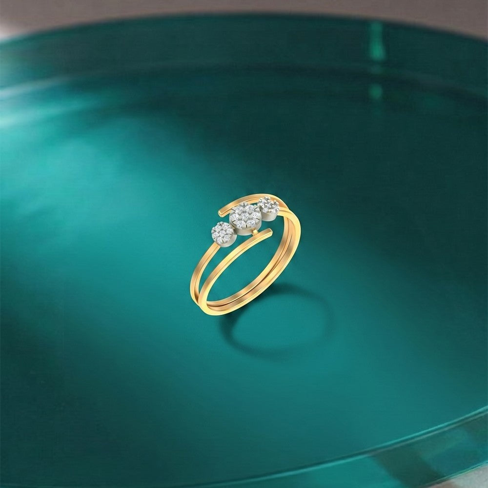 Gold and diamond with cluster setting on a blue surface.