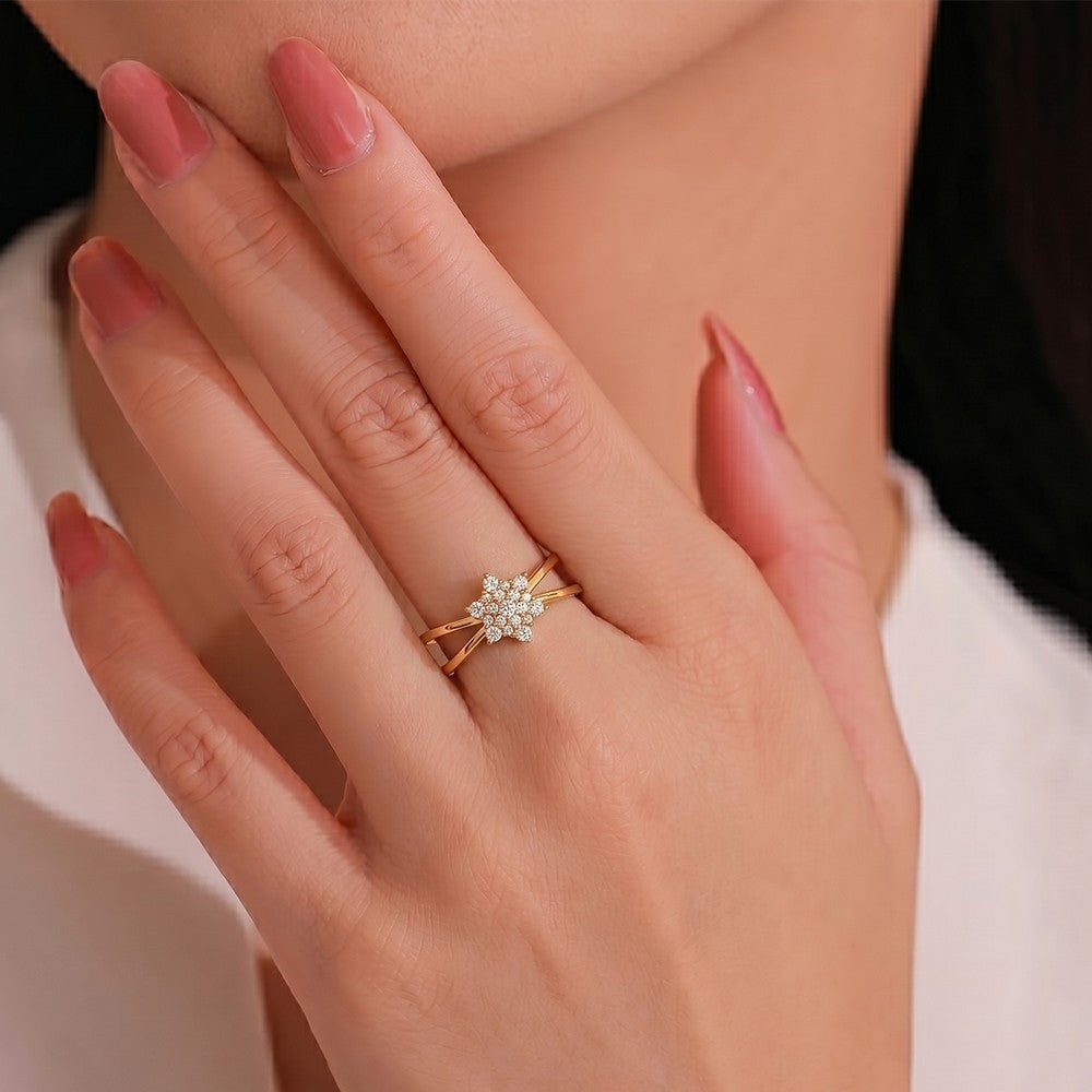 Close-up shot of a gold and diamond with floral cluster women's ring.