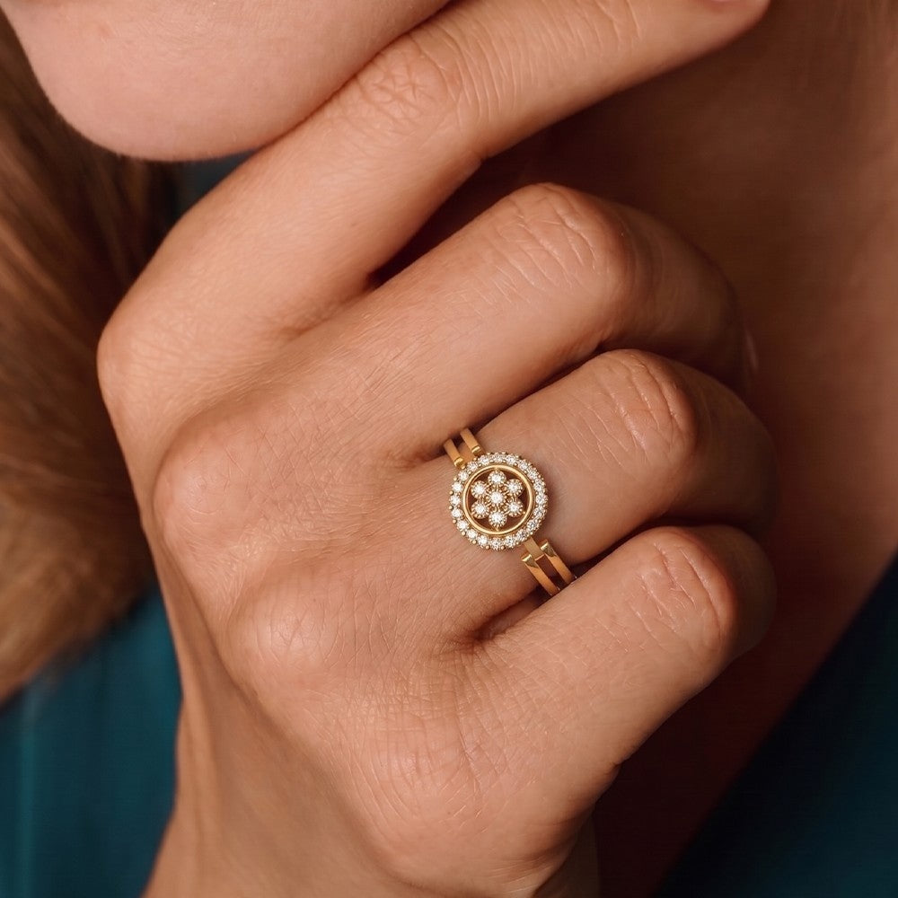 Close-up shot of a gold and diamond ring with cluster setting ring.