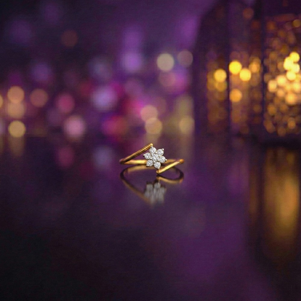 Gold and diamond with cluster setting on a reflective background.