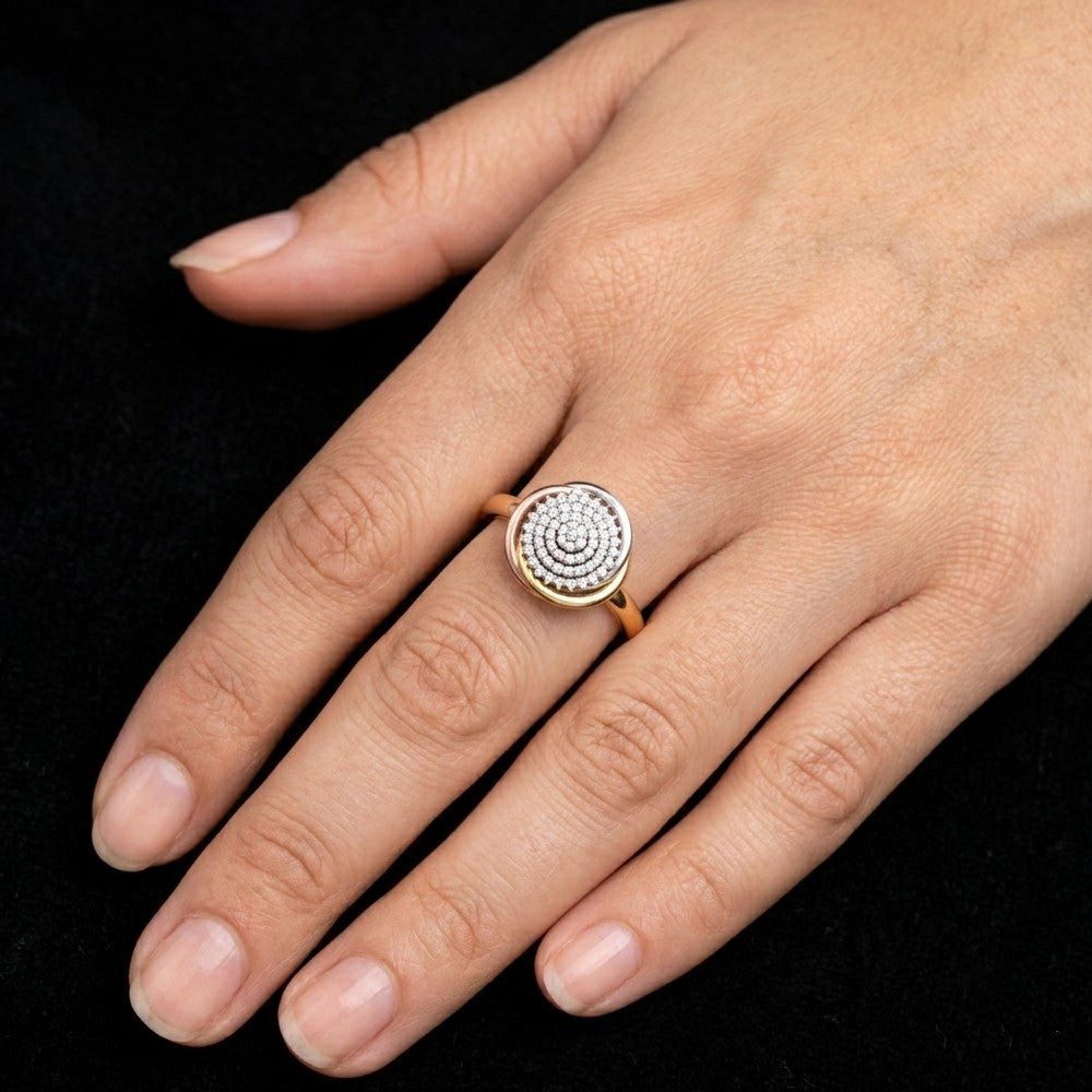 Close-up shot  of a gold and diamond floral design ring.