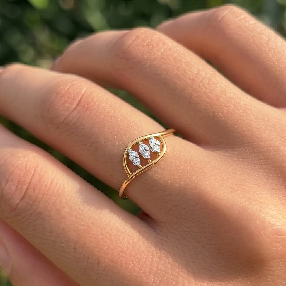 Close-up shot of a gold and diamond with triple marquise leaf openwork ring.