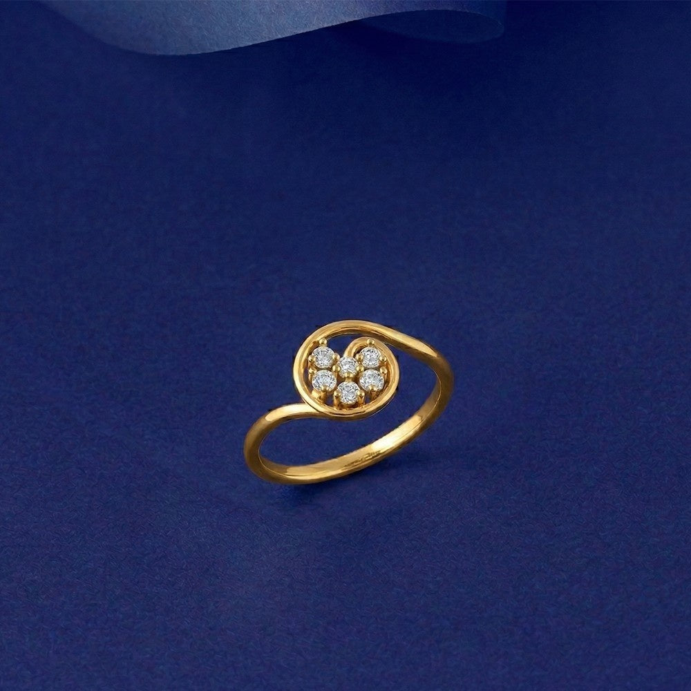 Gold ring with diamonds on a blue background