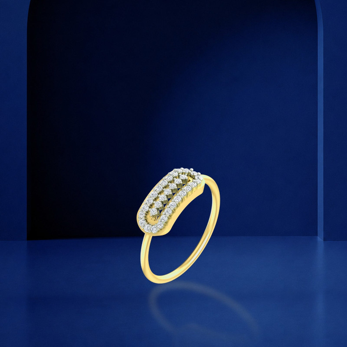 Gold and diamond band women's ring on a reflective blue background.