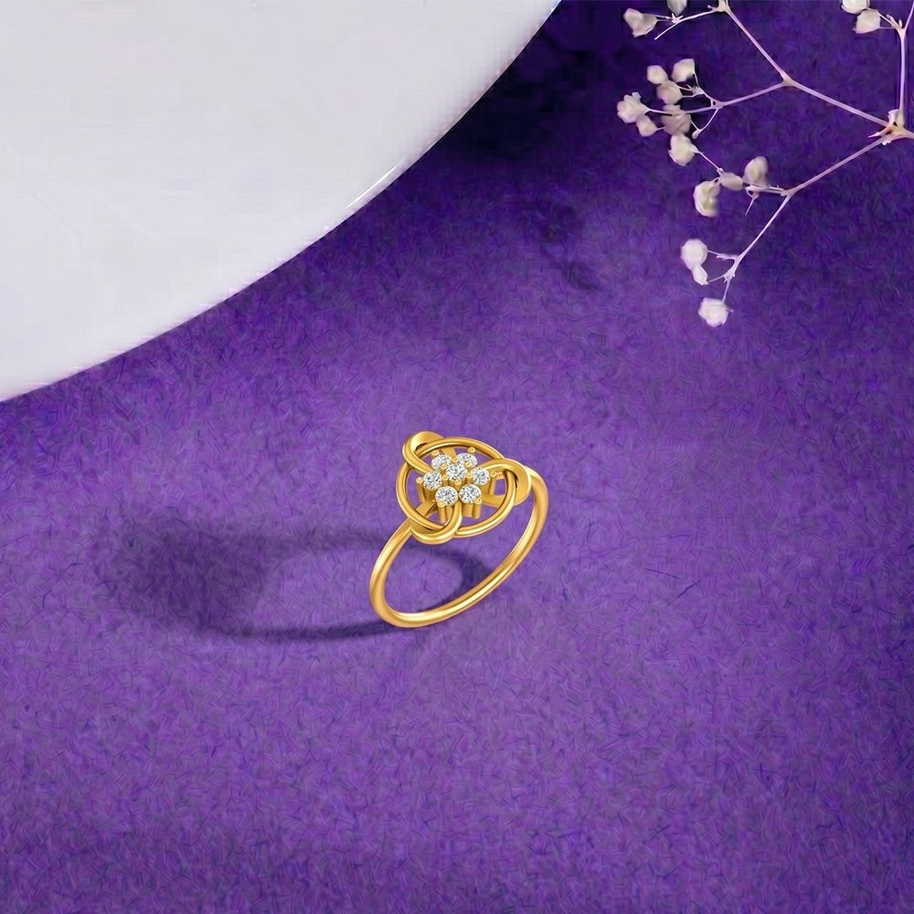 Gold and diamond with floral design on a blue surface.