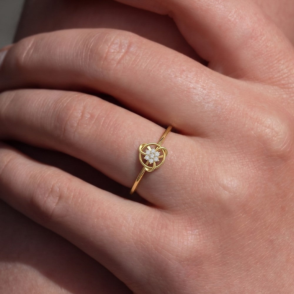 Close-up shots of a gold and diamond with floral design ring.