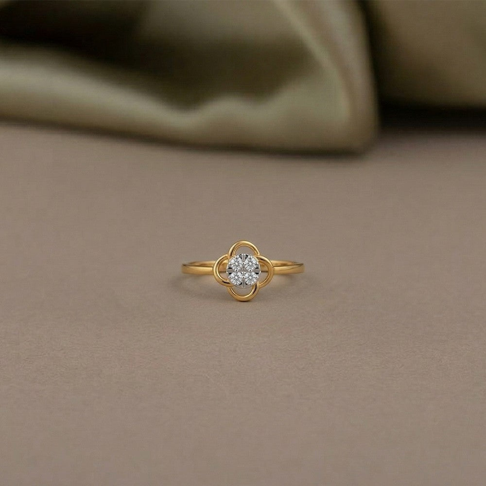 Gold ring with a diamond on a brown background