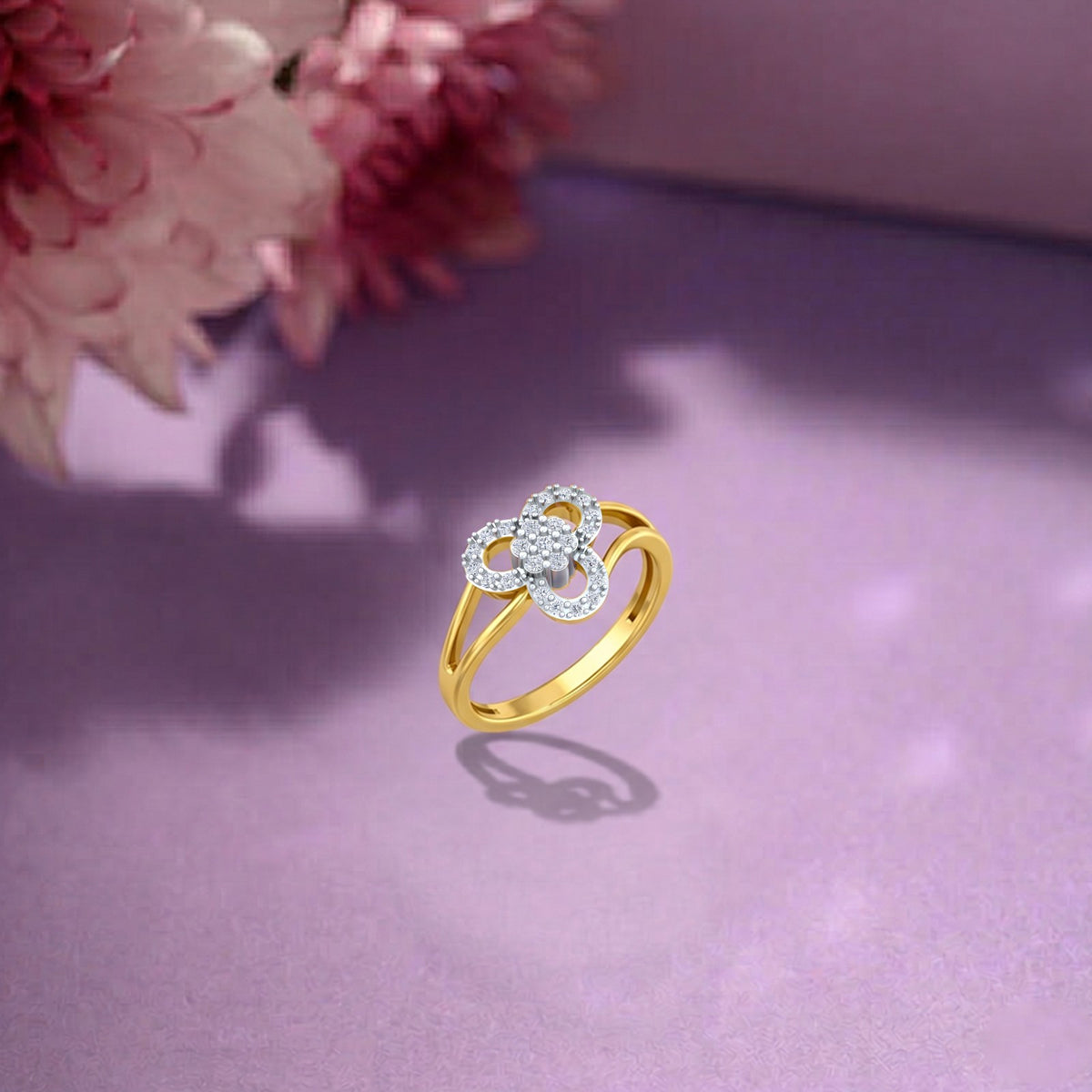 Gold and diamond with floral design on a purple surface.