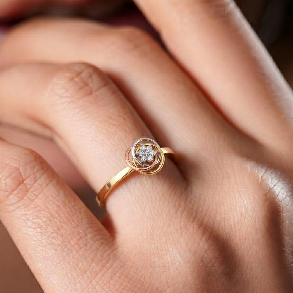 Close-up shots of a gold and diamond with floral design women's ring.