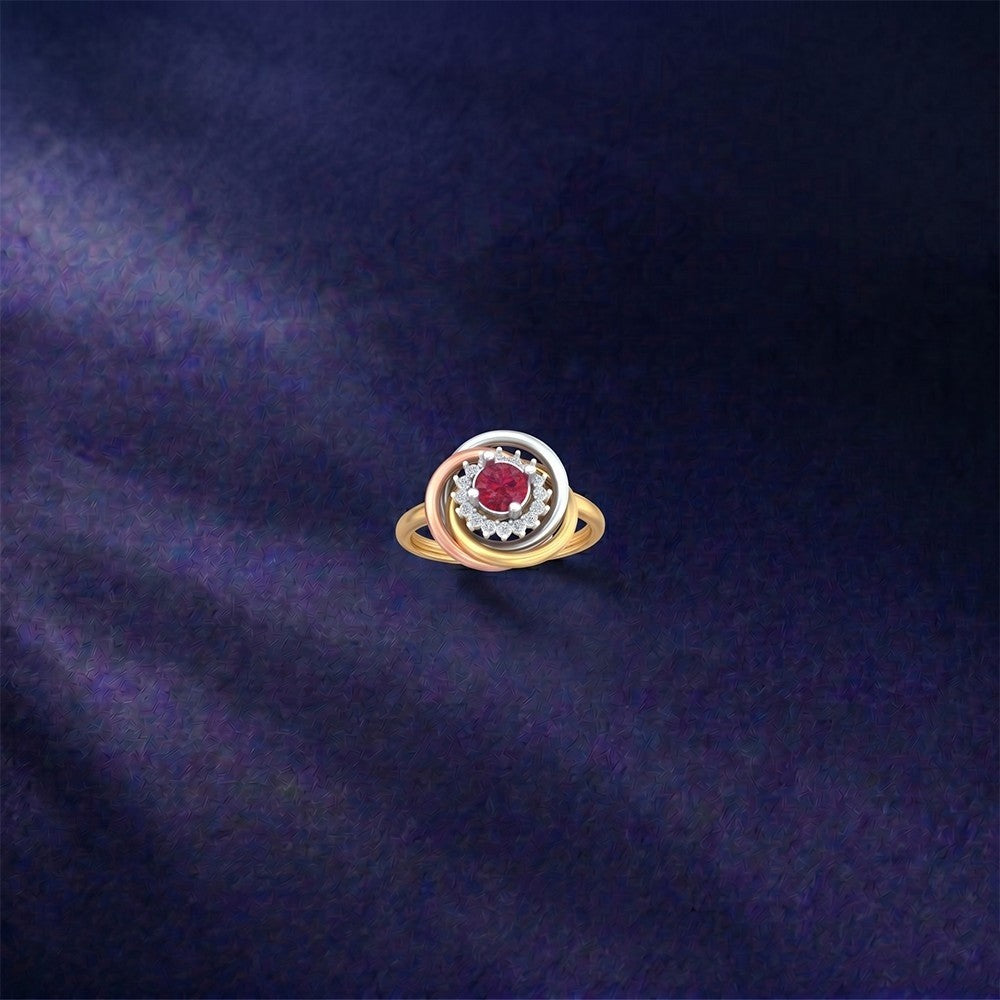 Gold ring with a ruby gemstone on a dark blue textured background