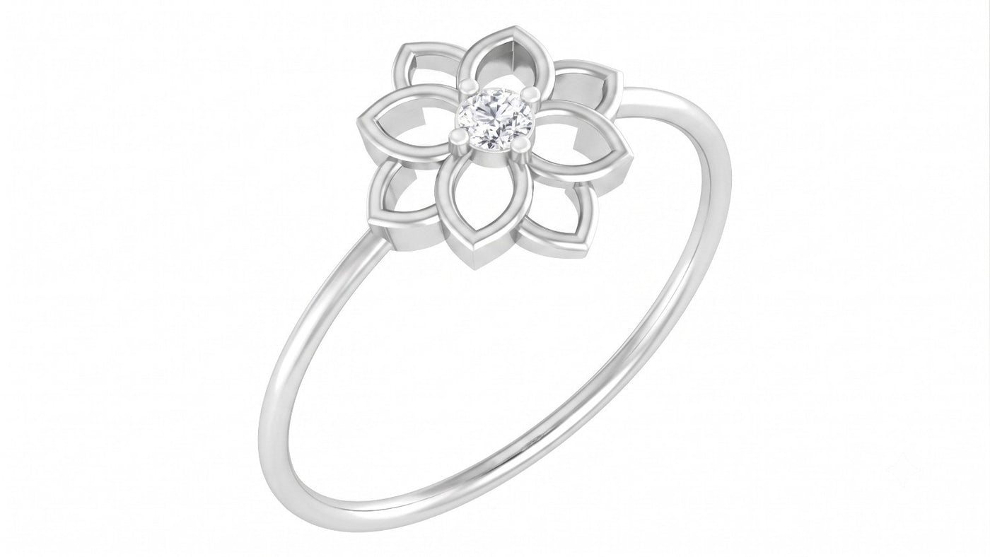 A white gold ring featuring a stylized flower design, set against a plain white background.