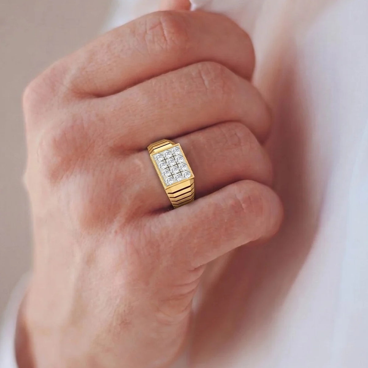 Men's wearing a gold and diamond ring for men featuring a cluster setting.