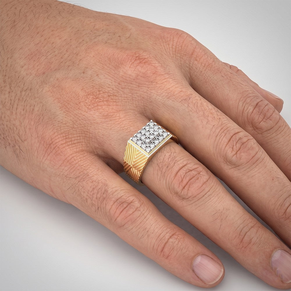 A close-up of a hand wearing a tring with a square white diamond face and a yellow gold textured band.
