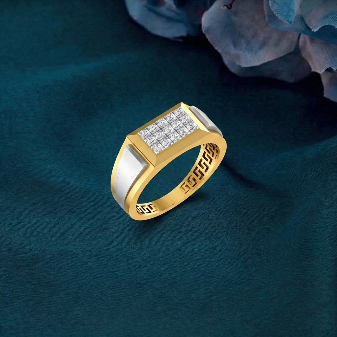 Gold and diamond ring with diamond accents on a dark blue background