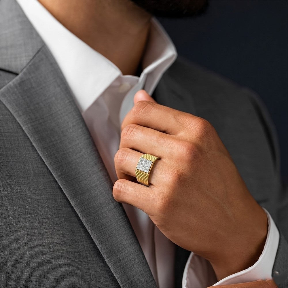 Person wearing a gray suit with a white shirt and gold ring, adjusting collar.