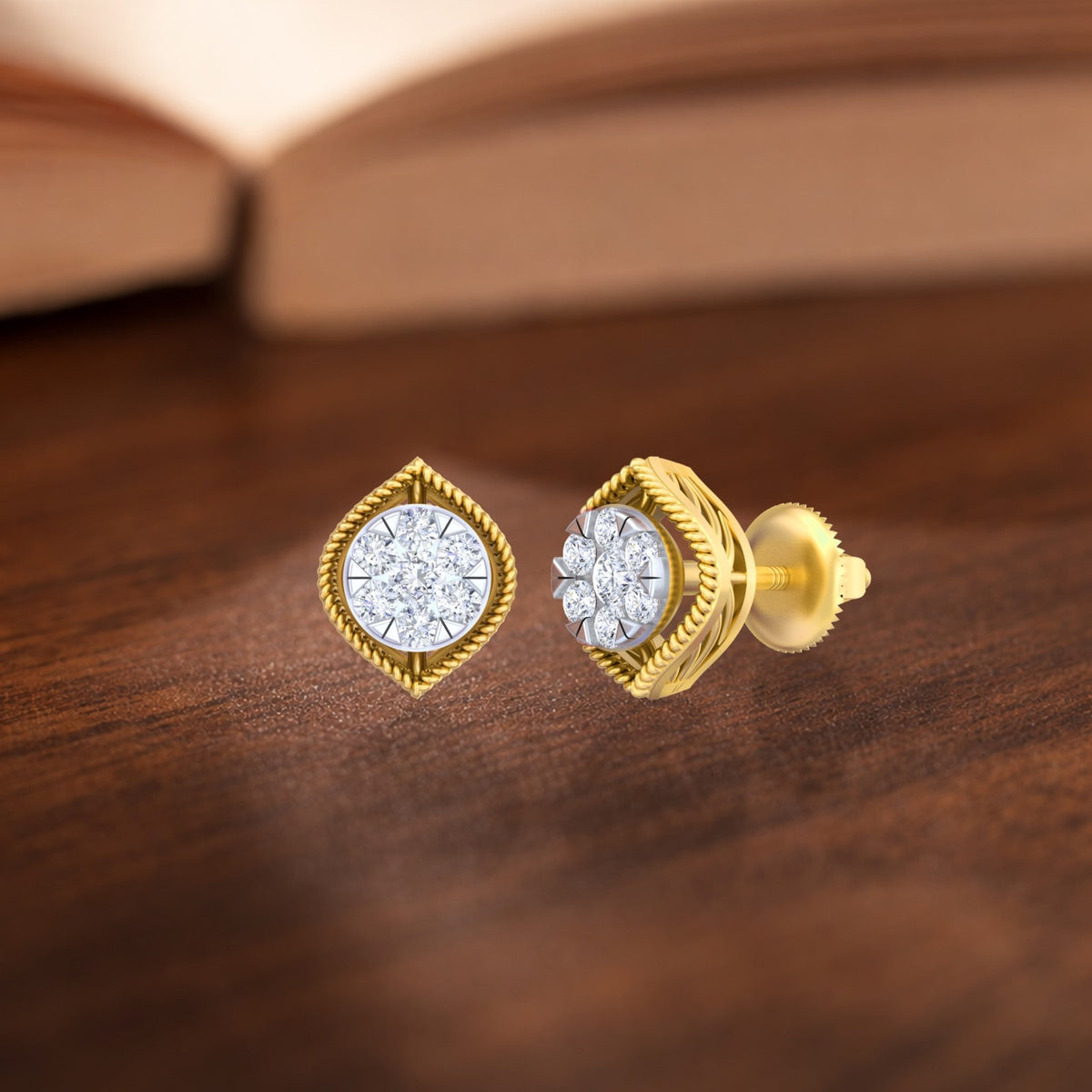 Pair of gold and diamond stud earrings on a wooden surface.