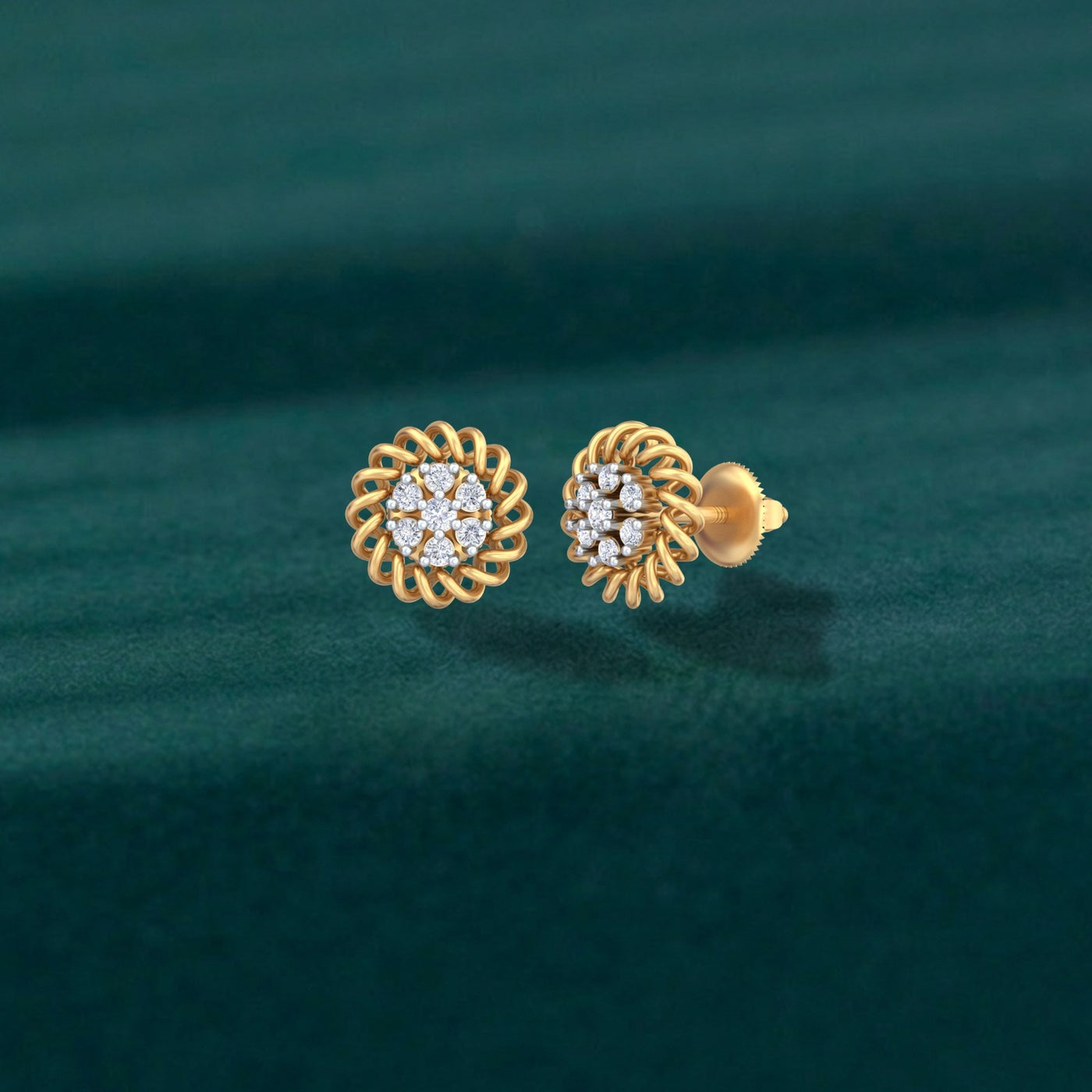 A pair of gold and diamond stud earrings with a braided circular design on a teal background.