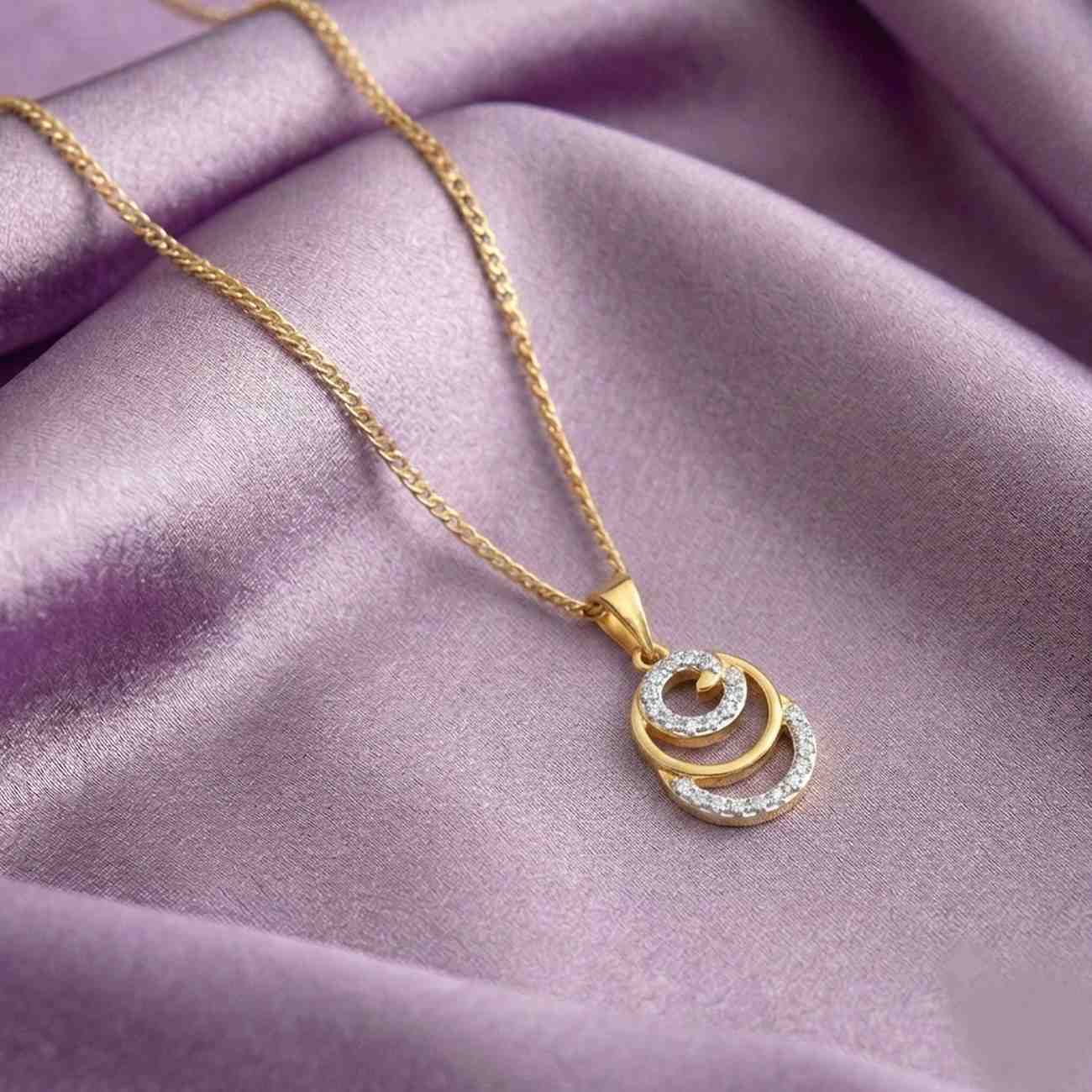 Gold with a diamond pendant on velvet cloth