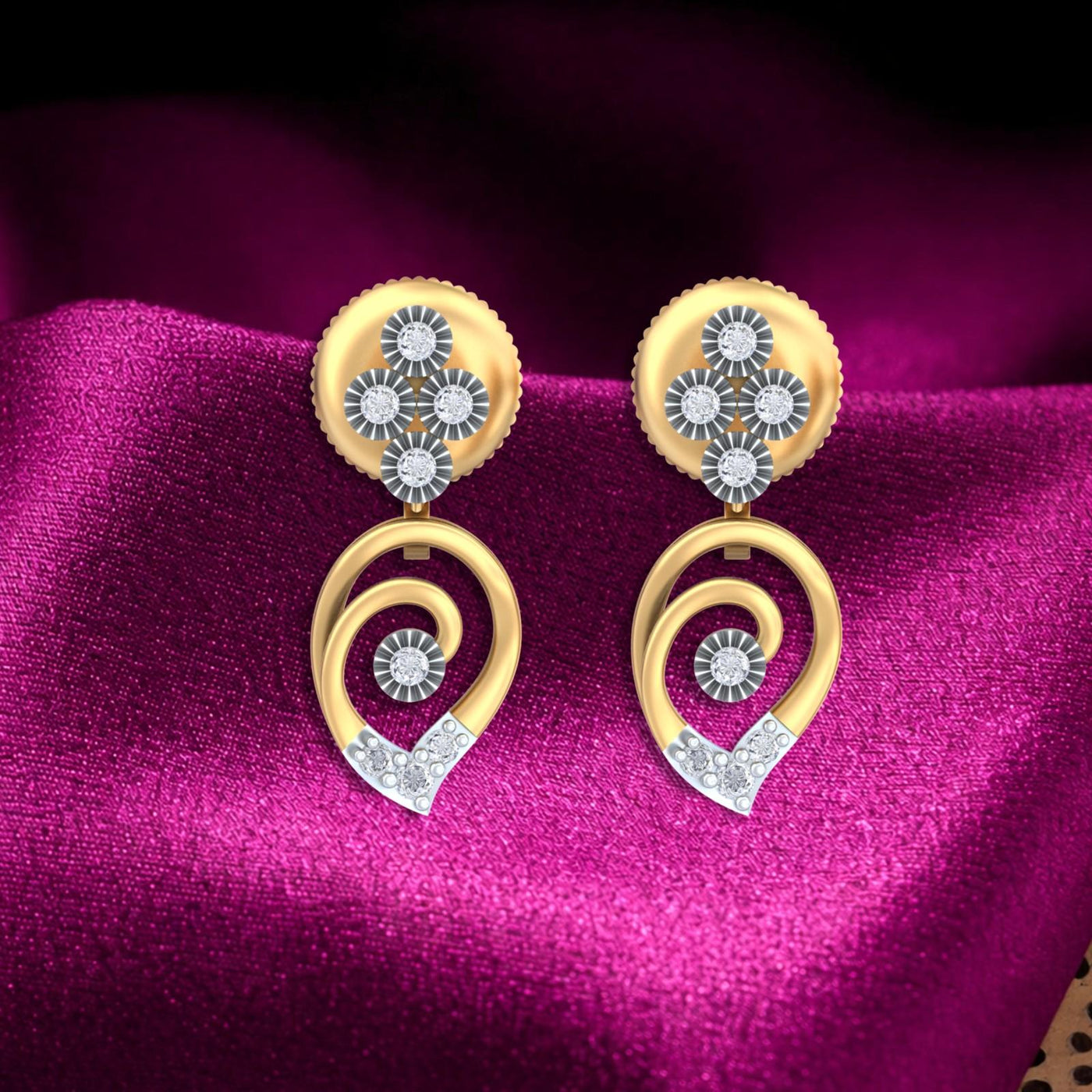 Gold and diamond drop earrings with floral designs on a magenta fabric background.