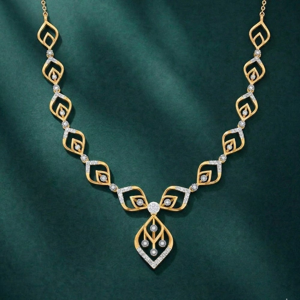 Gold and diamond necklace on a green background