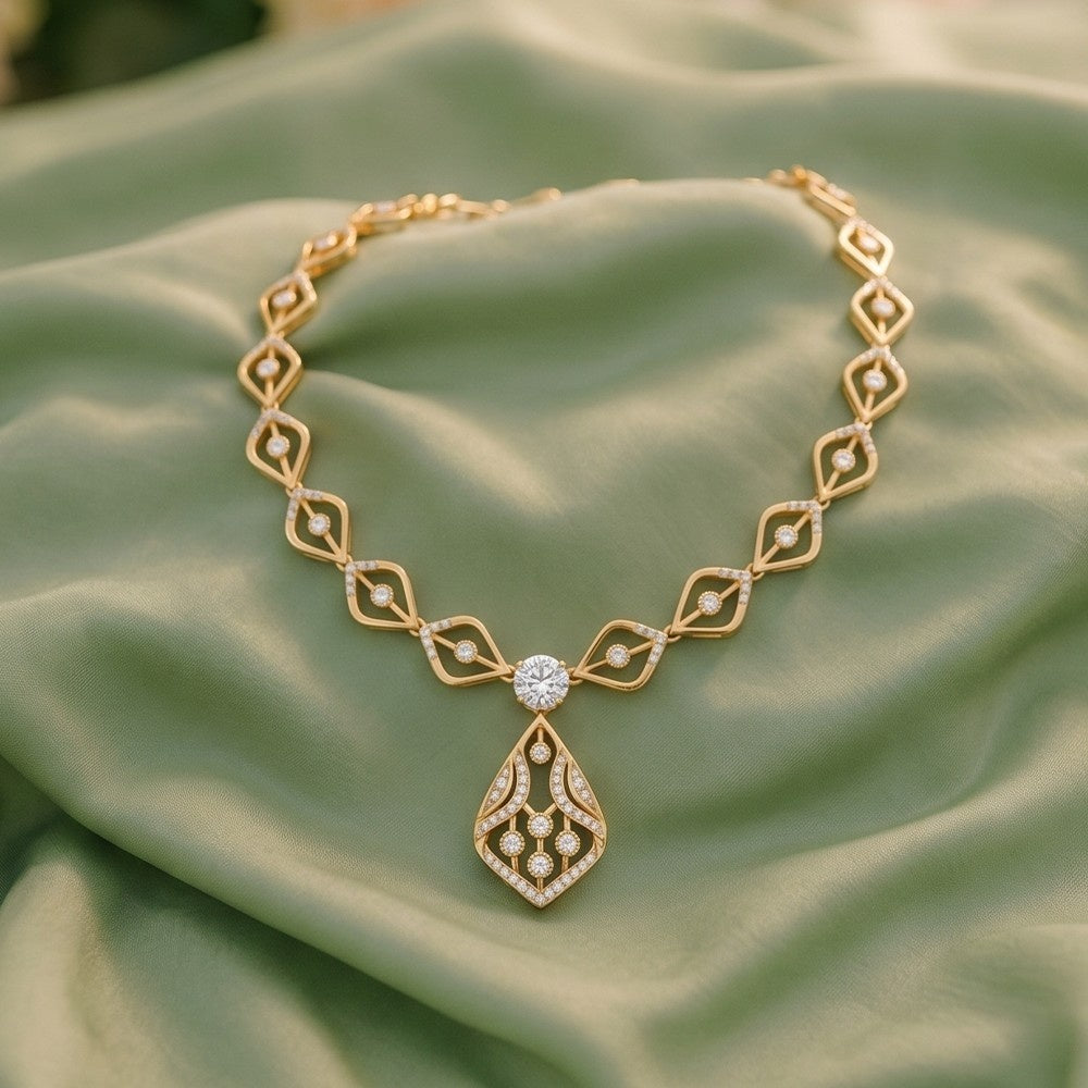 Gold necklace with diamond on a green fabric background