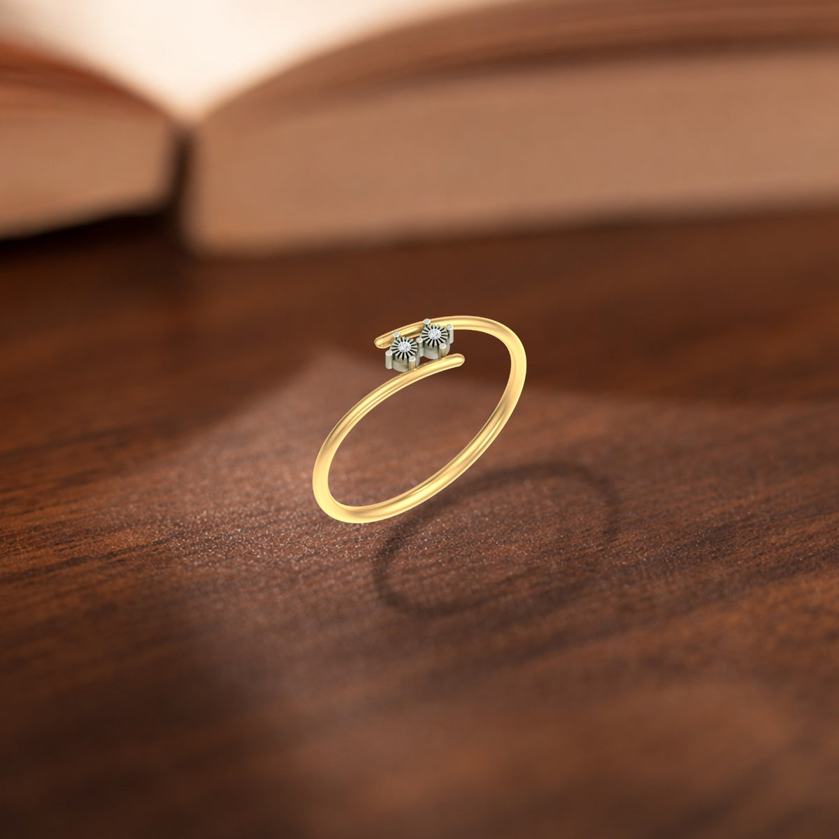Gold and diamond ring on a wooden surface.