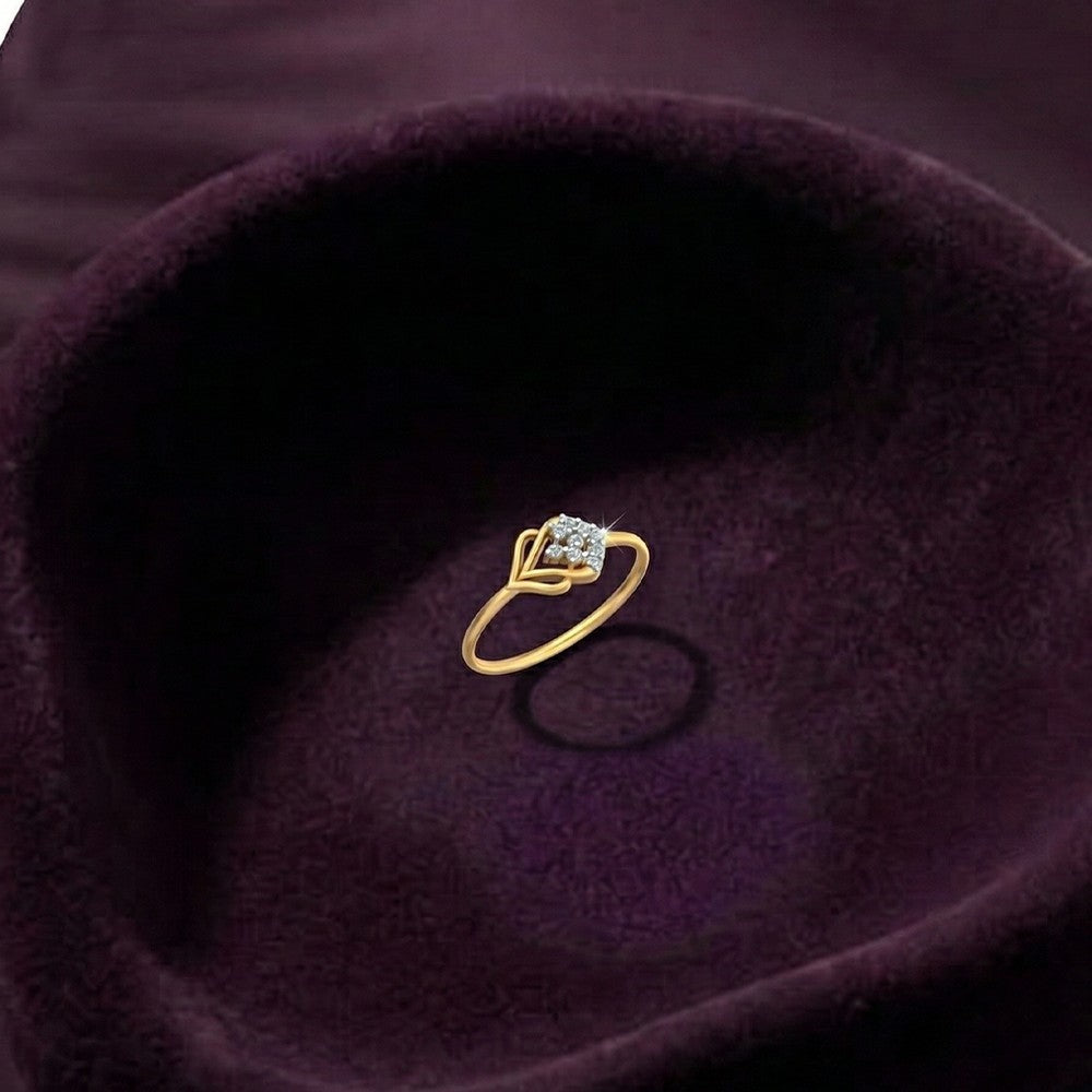 Gold and diamond with cluster setting on a fabric surface.
