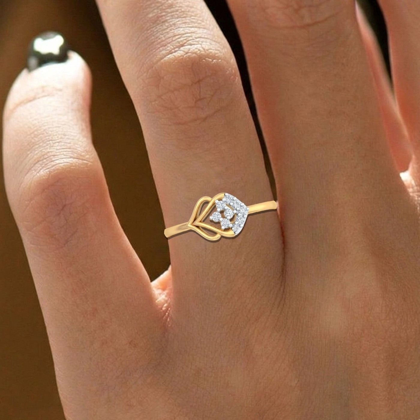 Close-up shot of a gold and diamond with cluster setting ring.