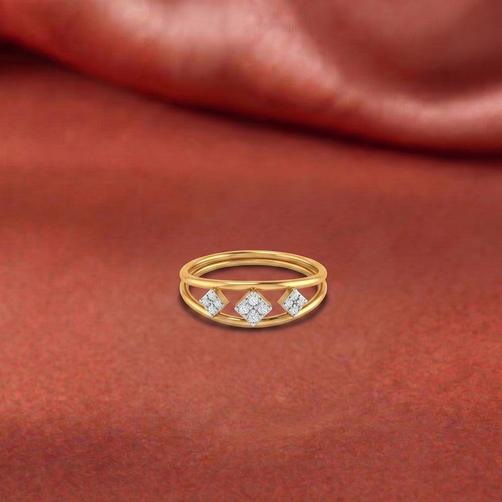 Gold and diamond with cluster setting on a orange surface.