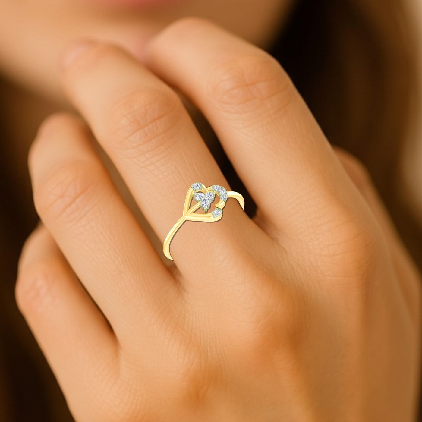 Close-up shot of a gold and diamond with floral design ring.