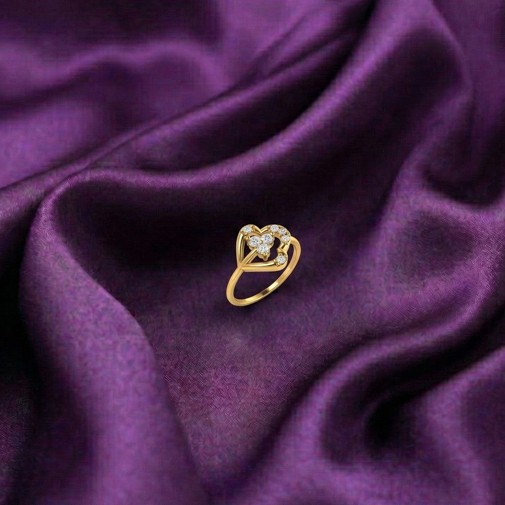 Gold and diamond with floral design on a purple fabric surface.