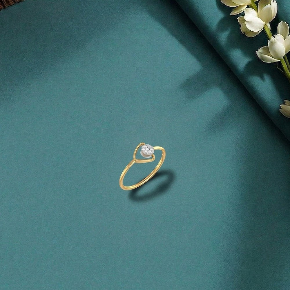Gold and diamond with cluster setting on a green surface.