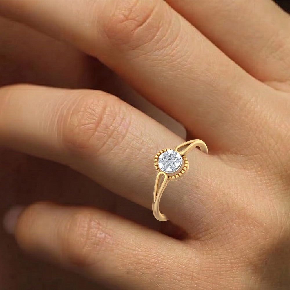 Close-up shot of a gold and diamond with cluster setting women's ring.