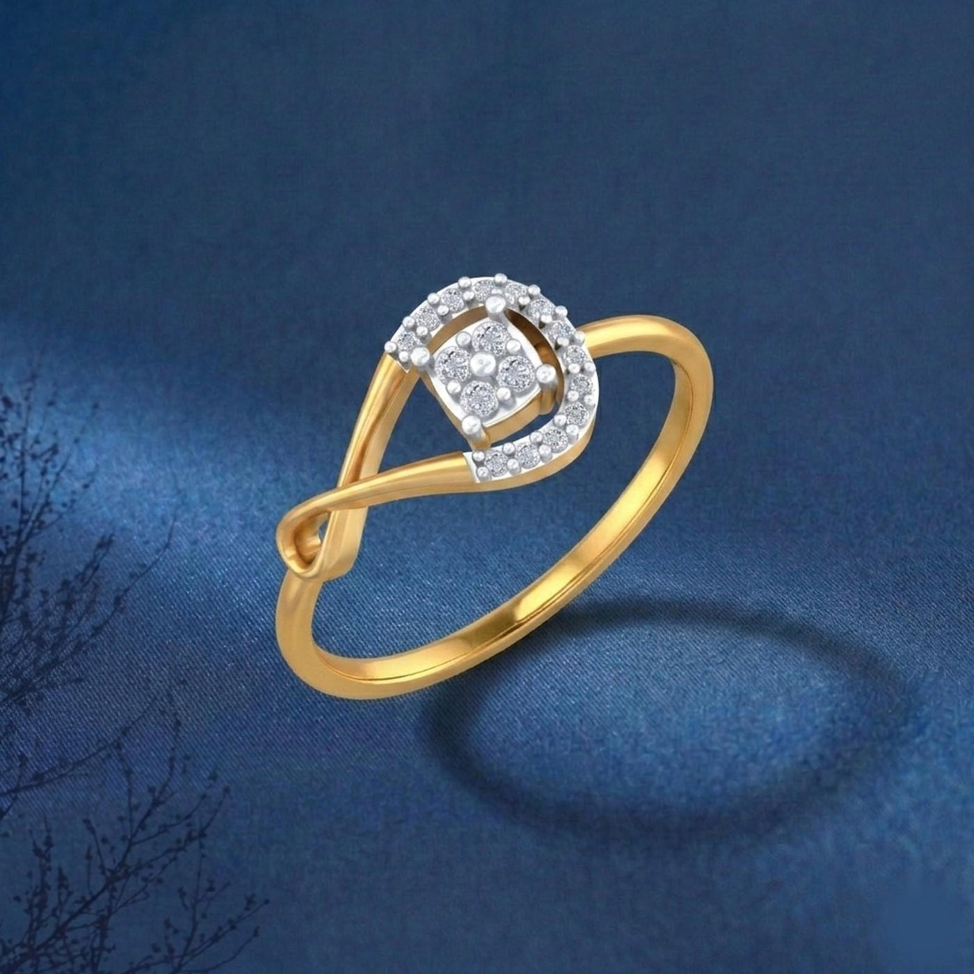 Gold and diamond with cluster setting on a blue surface.