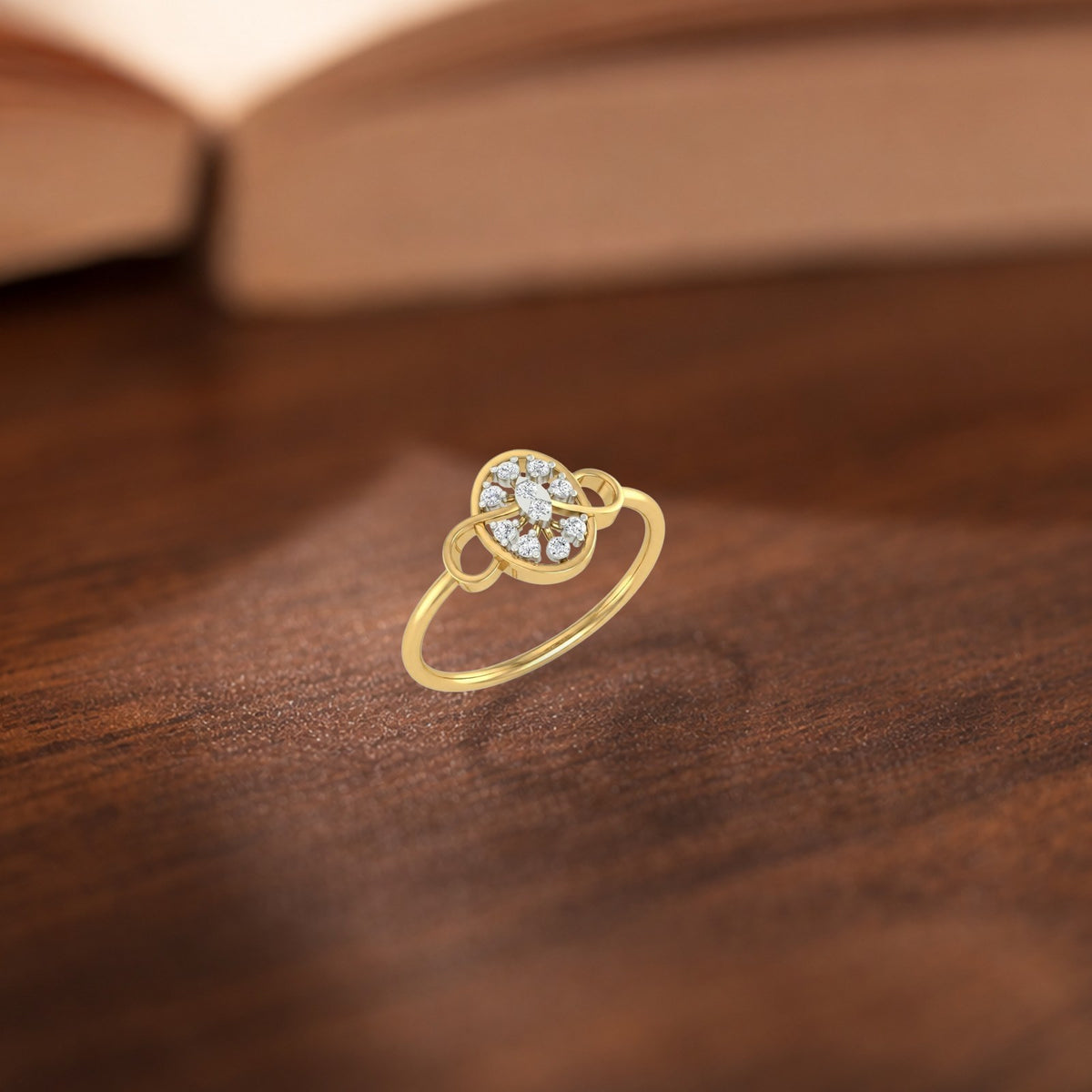 Gold and diamond with cluster setting on a wooden surface.