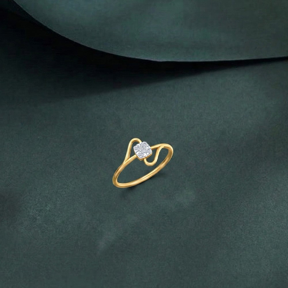 Gold and diamond with cluster setting on a green surface.