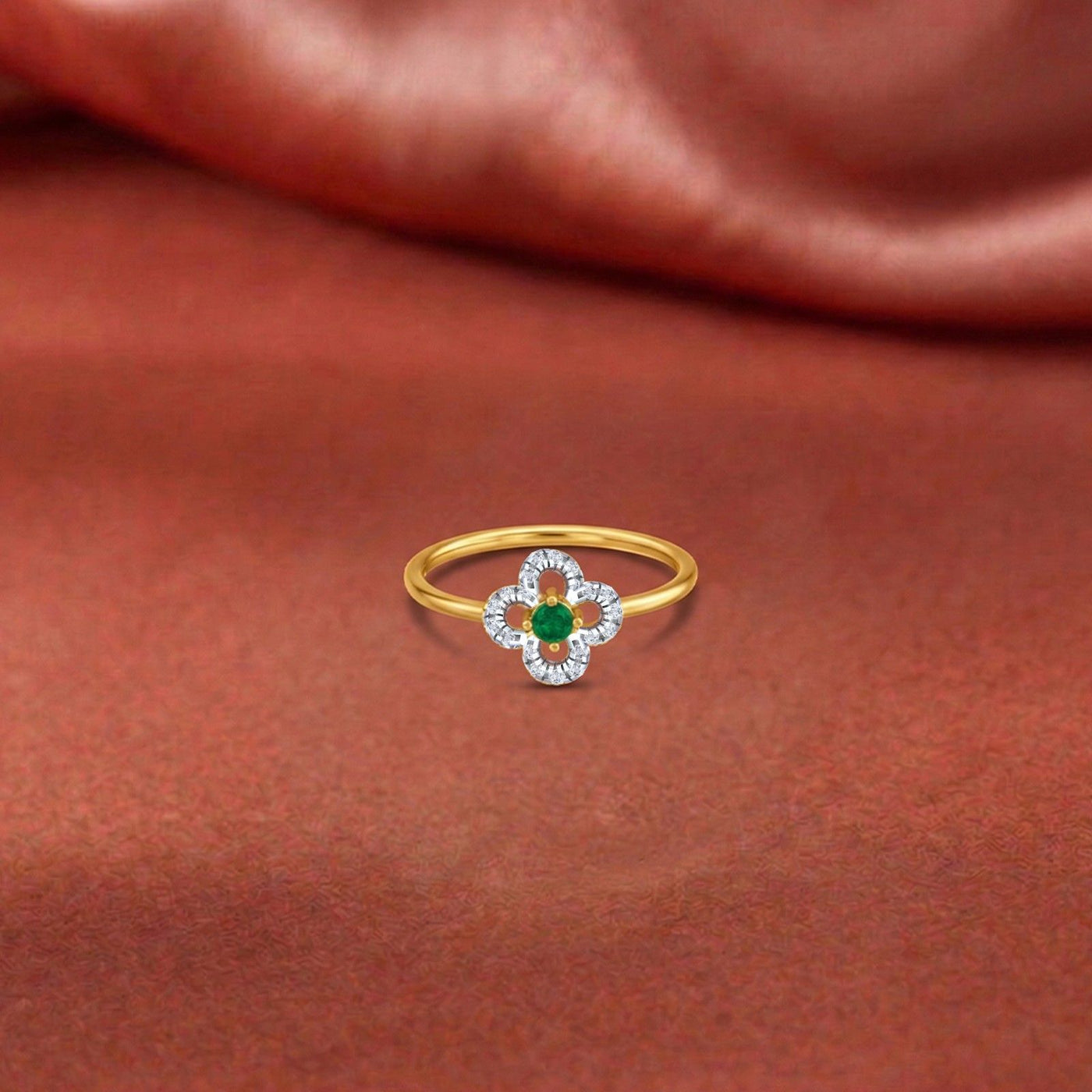 Gold and diamond with floral-design and center emerald gemstone setting ring.
