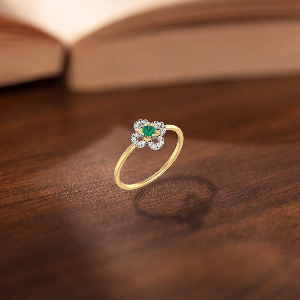 Gold and diamond with floral-design and center emerald gemstone setting ring.