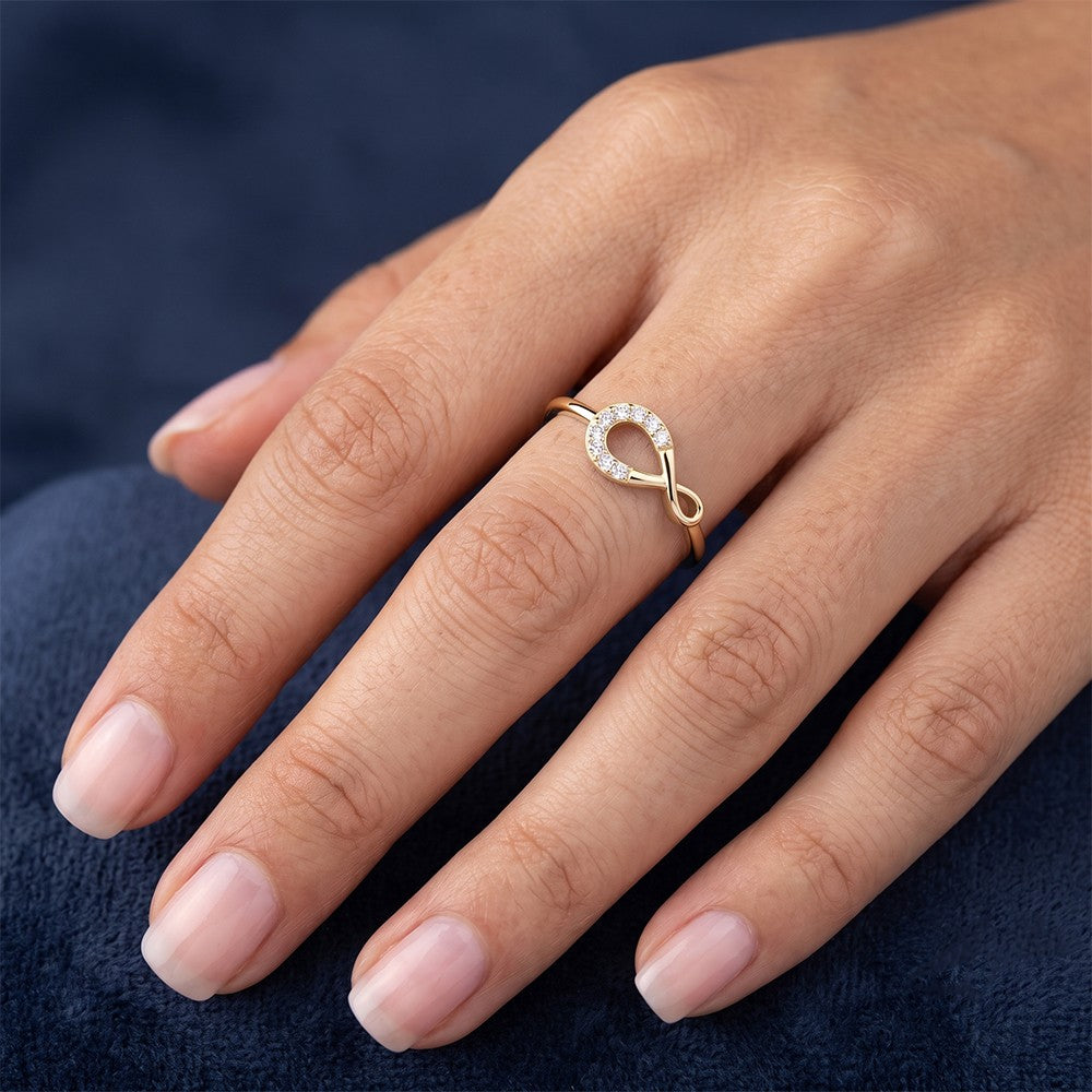 Close-up shot of a gold and diamond women's ring.