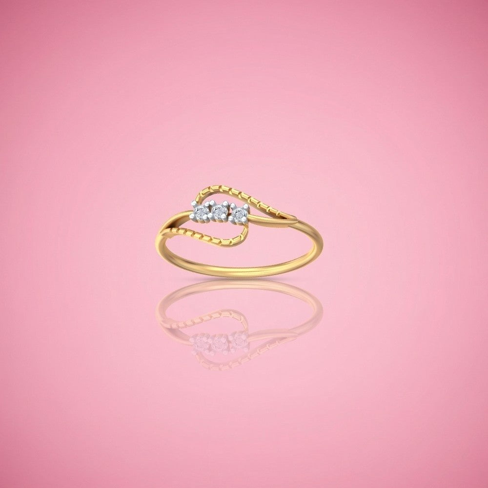 Gold and diamond women's ring on a pink reflective surface.