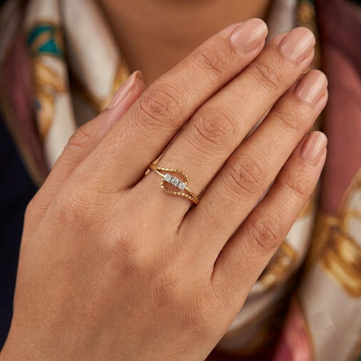 Close-up shot of a gold and diamond women's ring.