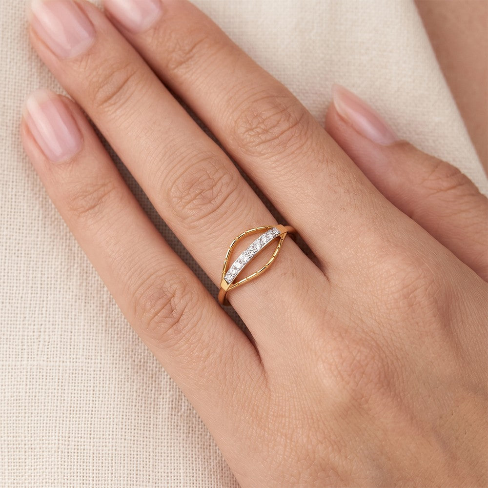 Close-up shot of a gold and diamond with half-eternity women's ring. 