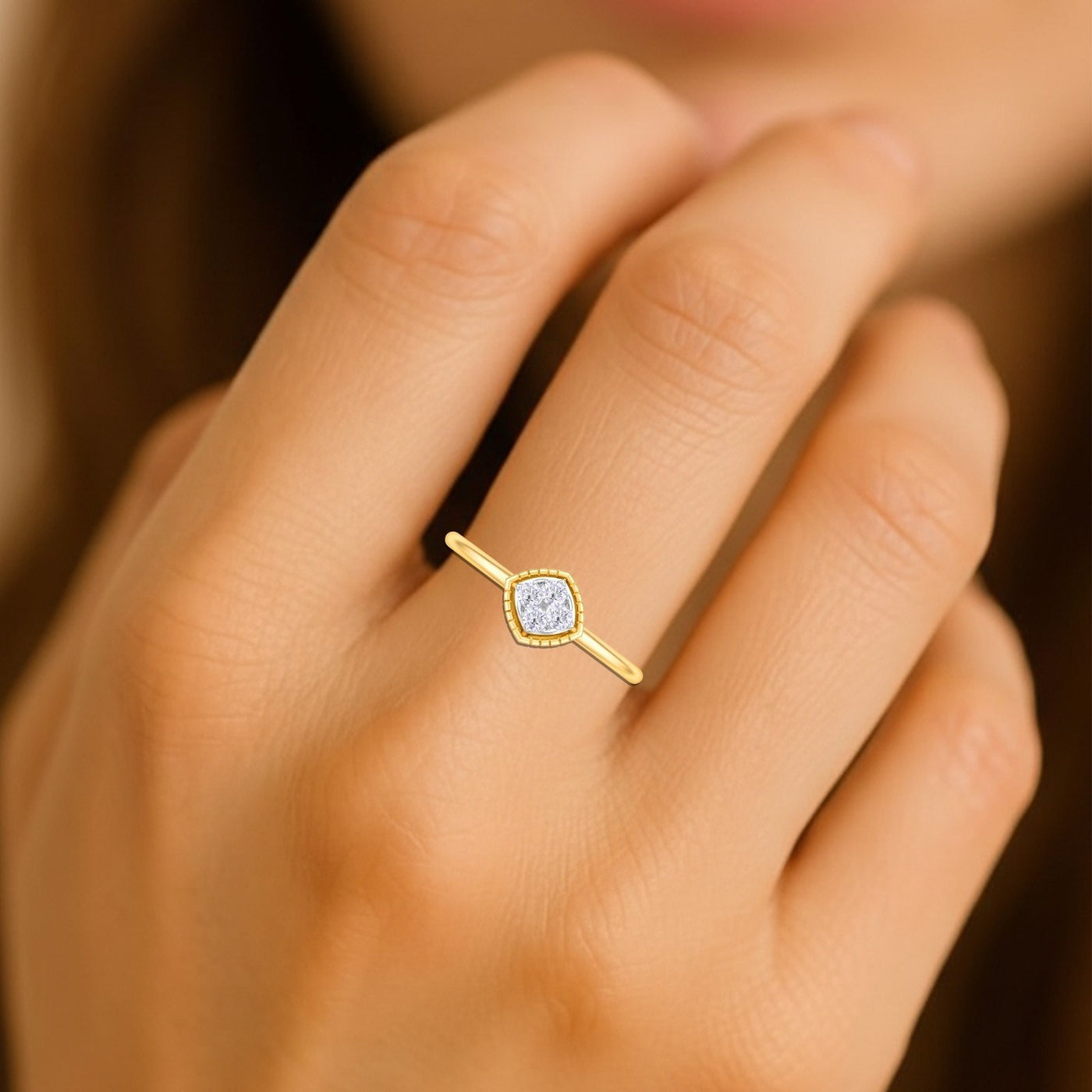 Close-up shot of a gold and diamond with square-shaped cluster setting ring.