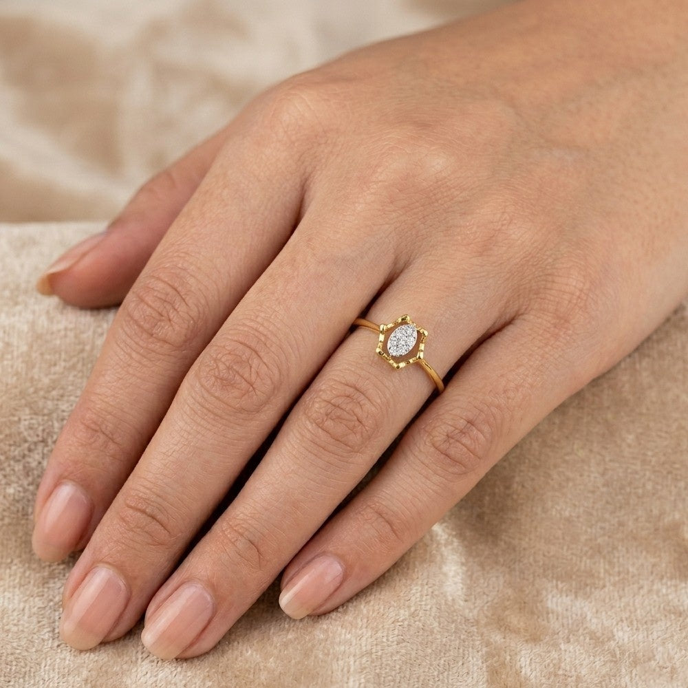 Rose gold ring with a heart-shaped gemstone on a white background