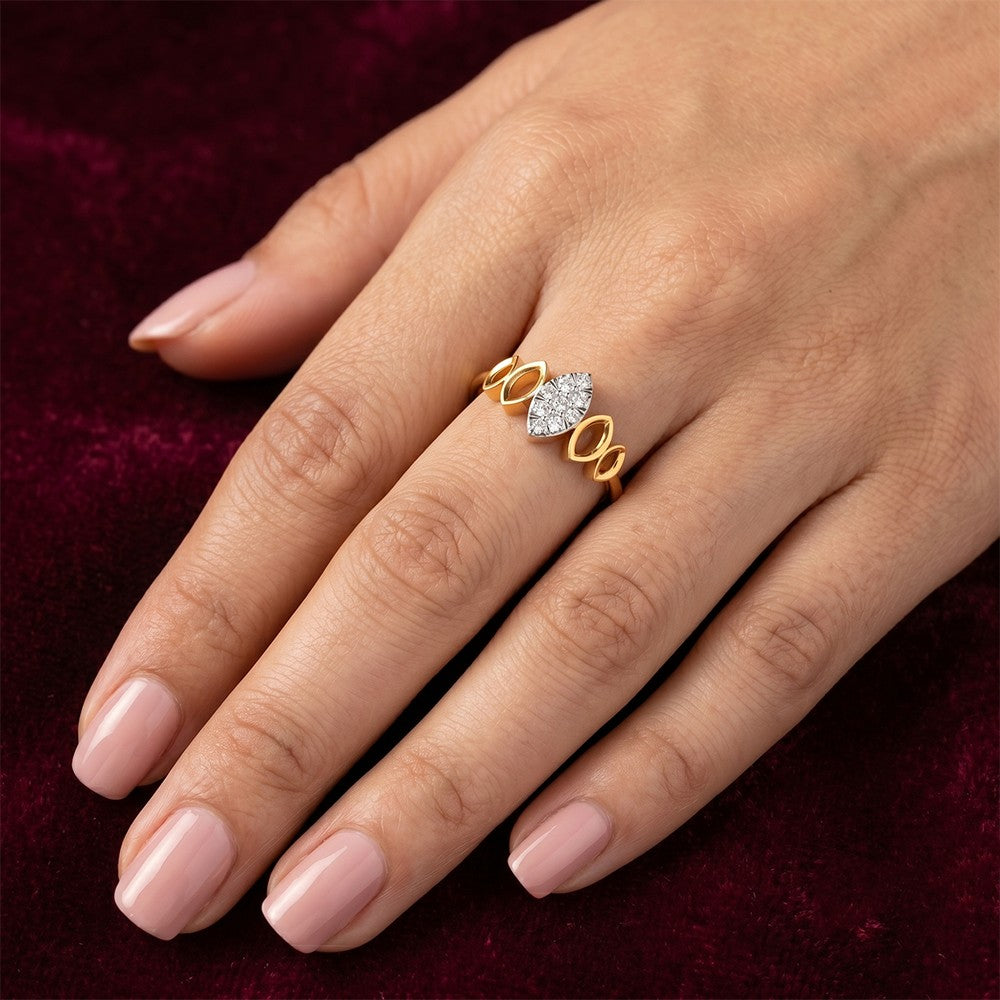 Gold ring with a diamond on a hand against a dark background