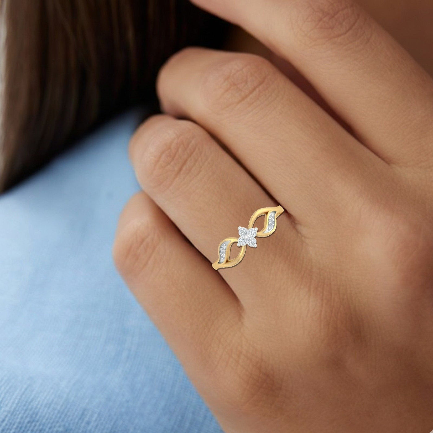 Close-up shot of a gold and diamond with center diamond setting ring.